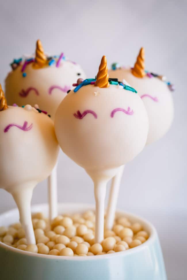 unicorn cake pops in a cup.