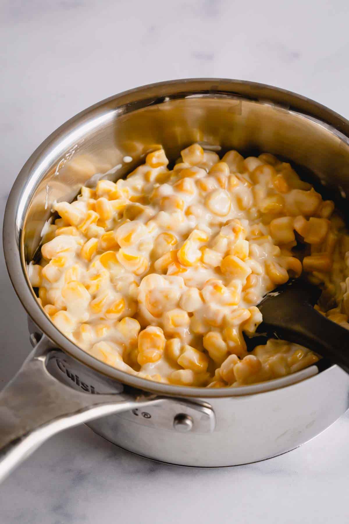 creamed corn in a saucepan.