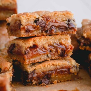a stack of caramel cookie bars.
