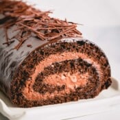 a chocolate roll cake with mousse in the middle