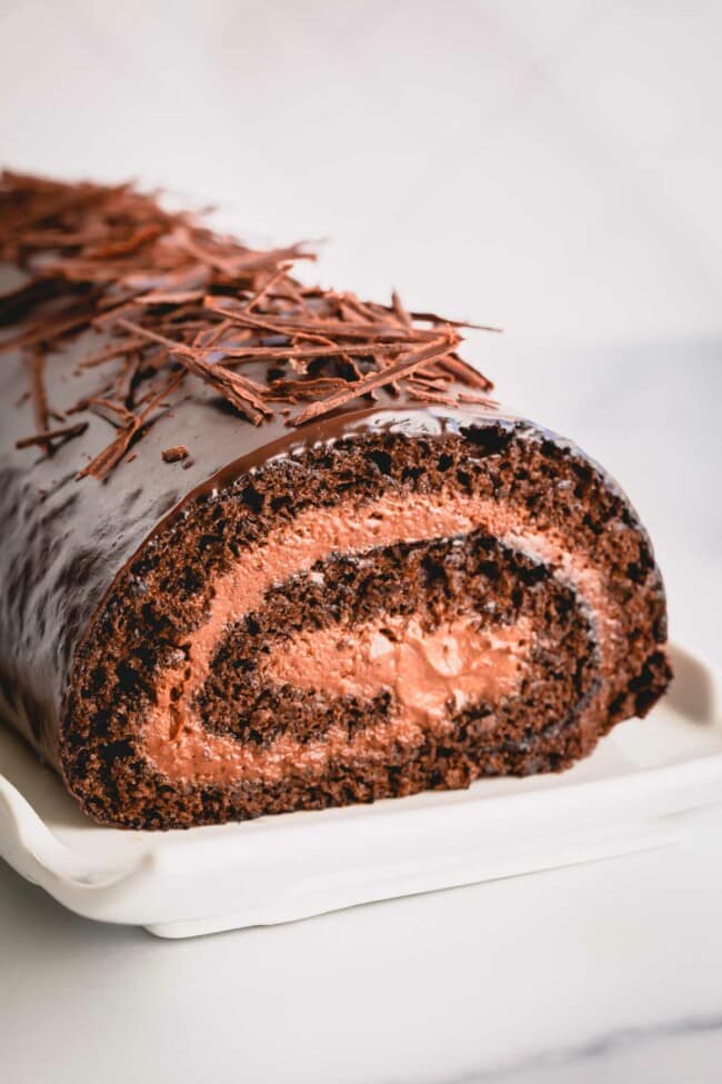 a chocolate roll cake with mousse in the middle