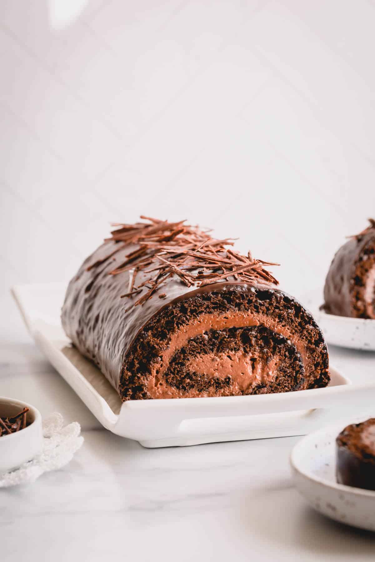 a chocolate swiss roll on a plate