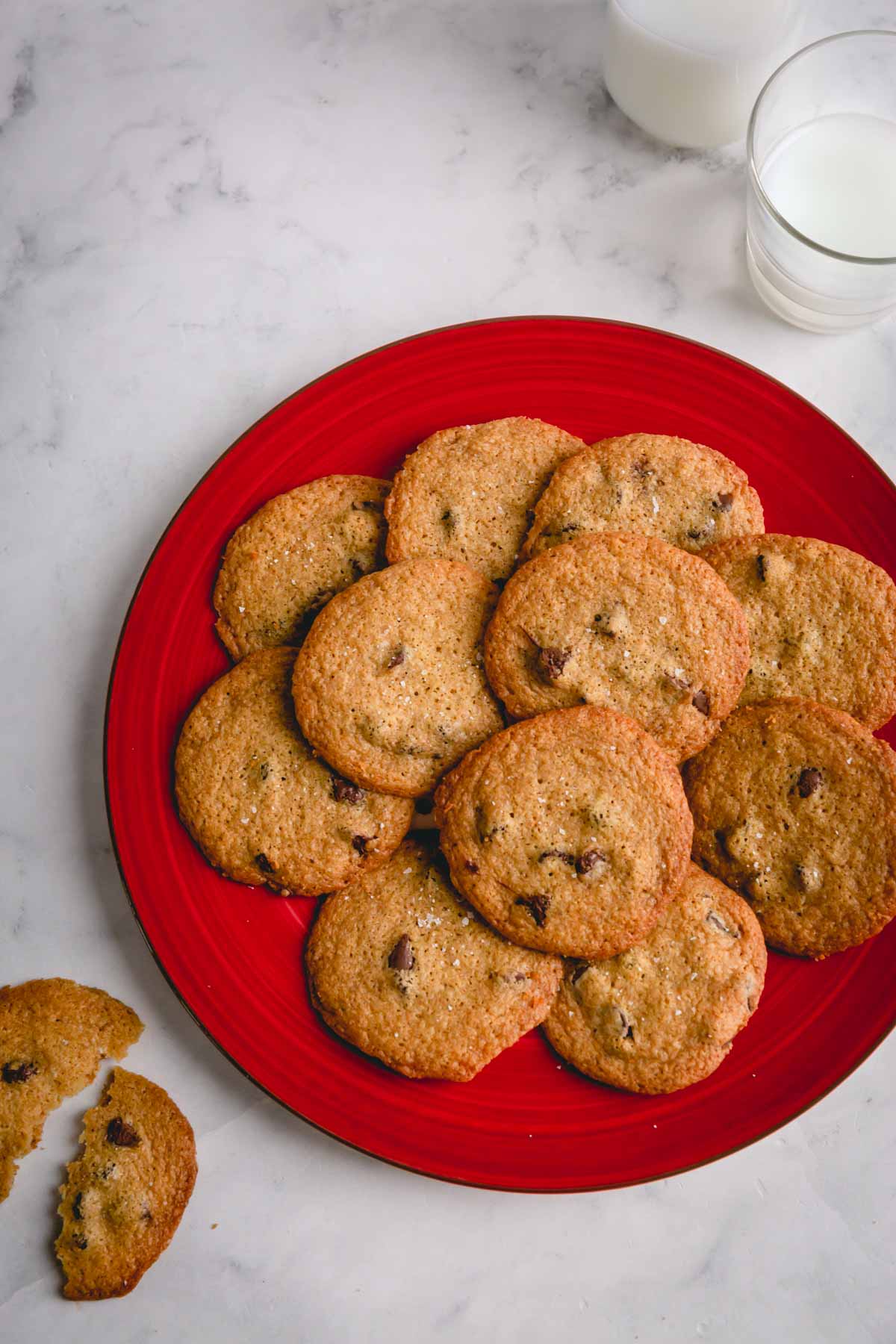a plate of thin chocolate chip cookies.