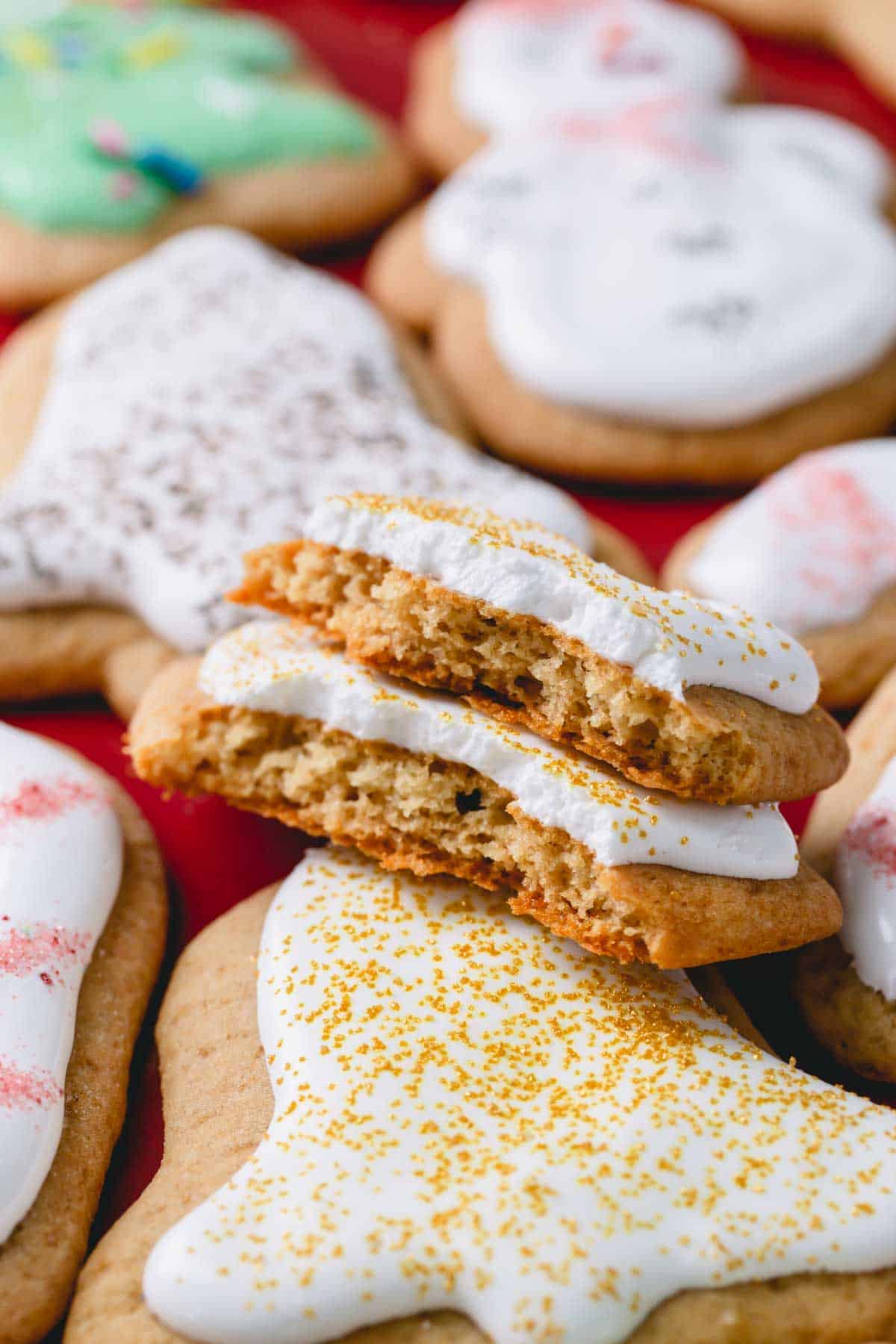 a frosted honey cookie with a bite out of it.