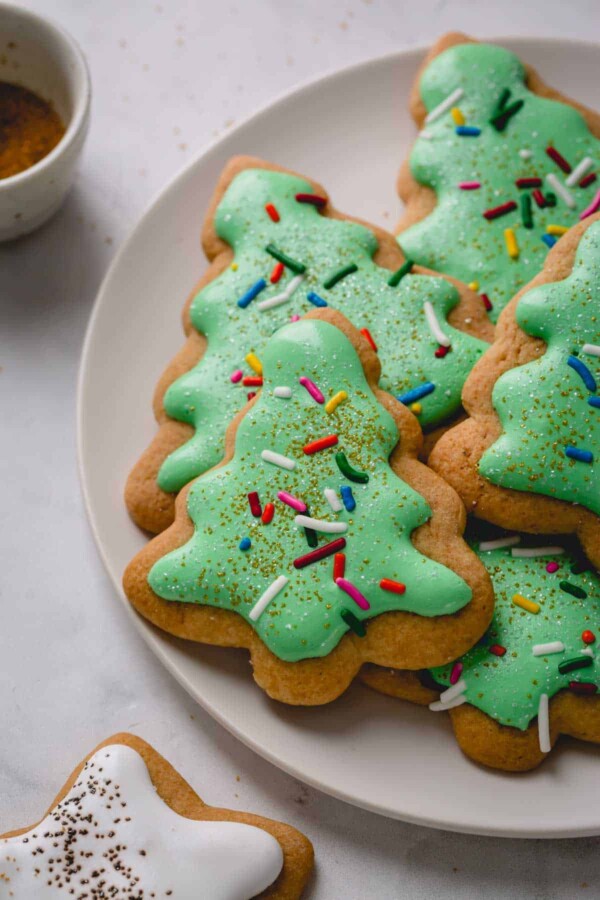 a plate of cookies decorated like christmas trees