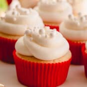 Champagne cupcake with white frosting.