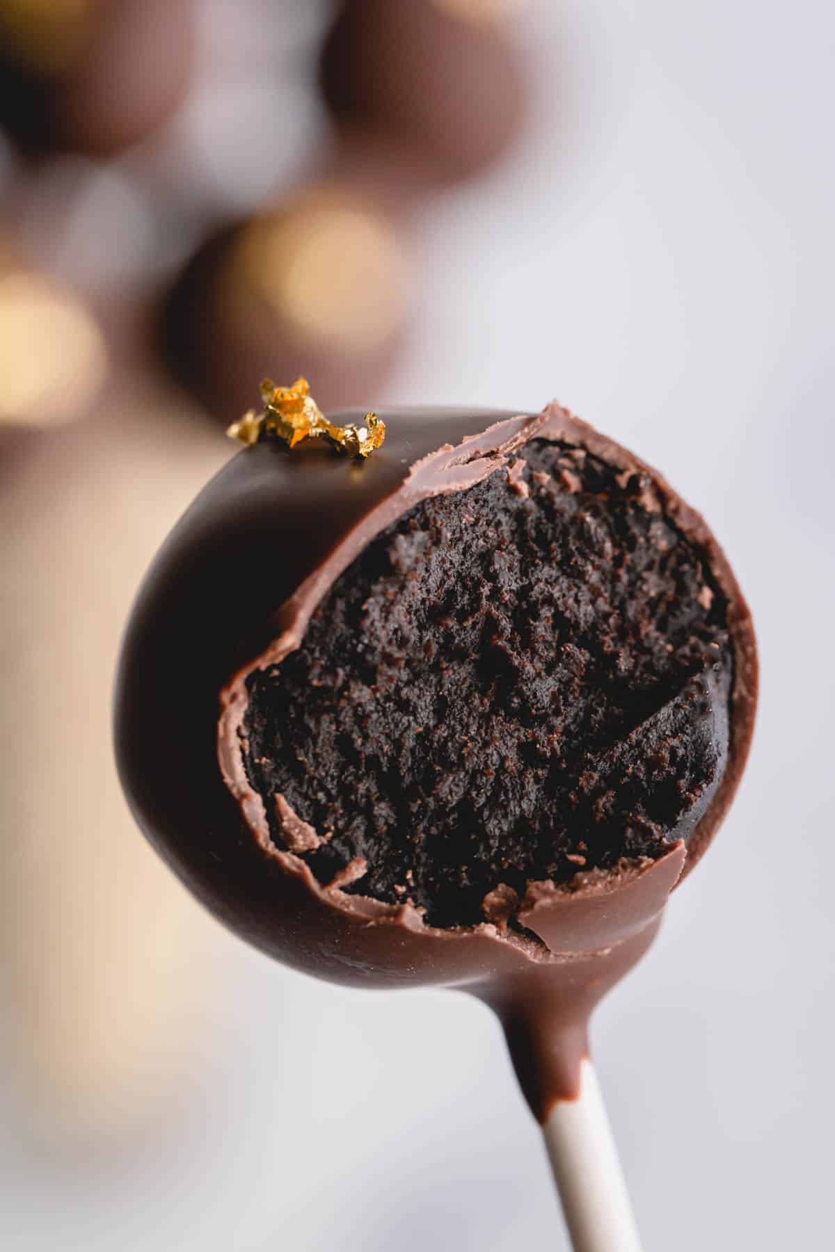 a bite out of a chocolate cake pop.