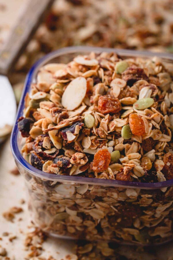 a scoop of granola with almonds and dried fruit.