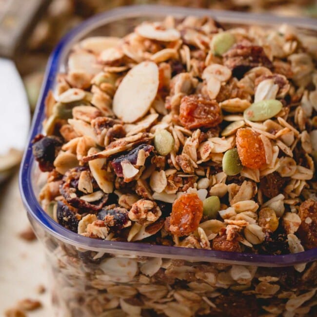 a scoop of granola with almonds and dried fruit.