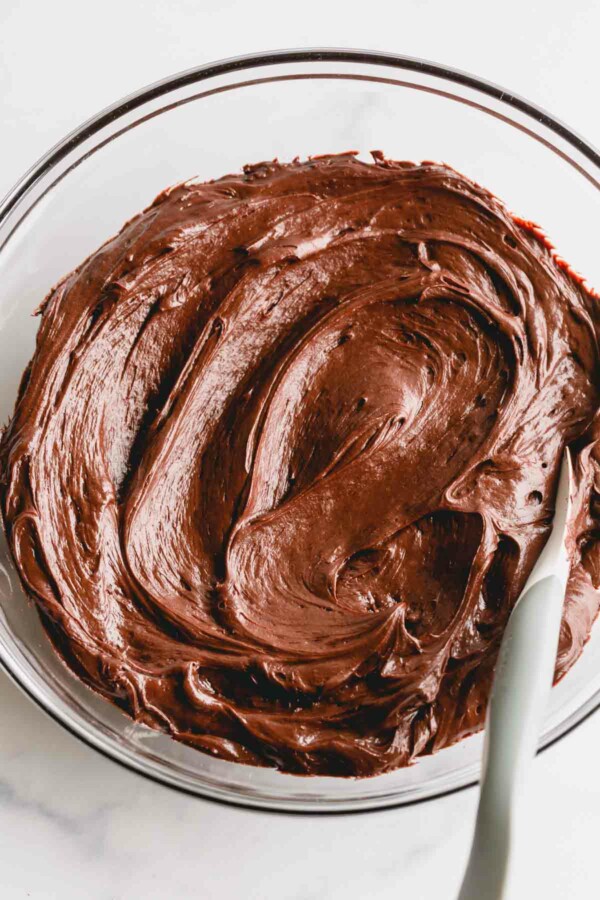 a bowl of chocolate cream cheese icing.