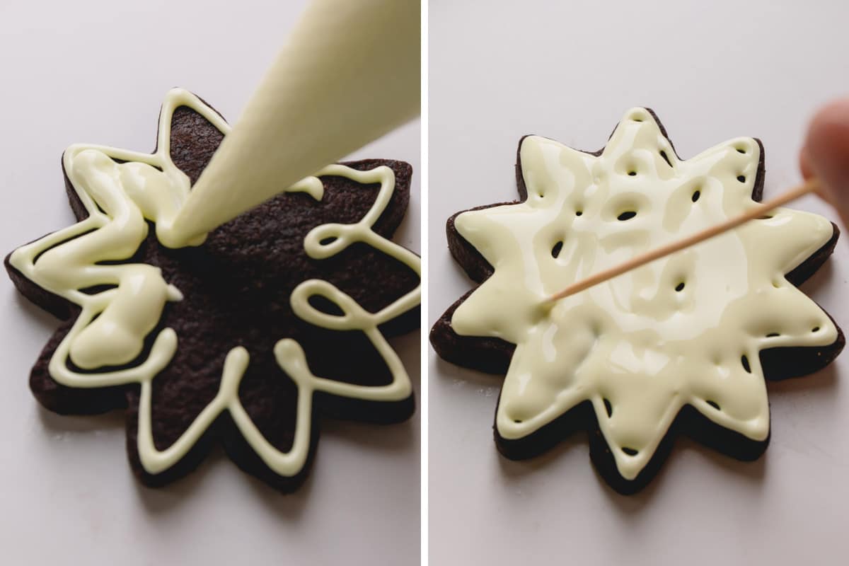 piping icing onto a chocolate star cookie. 