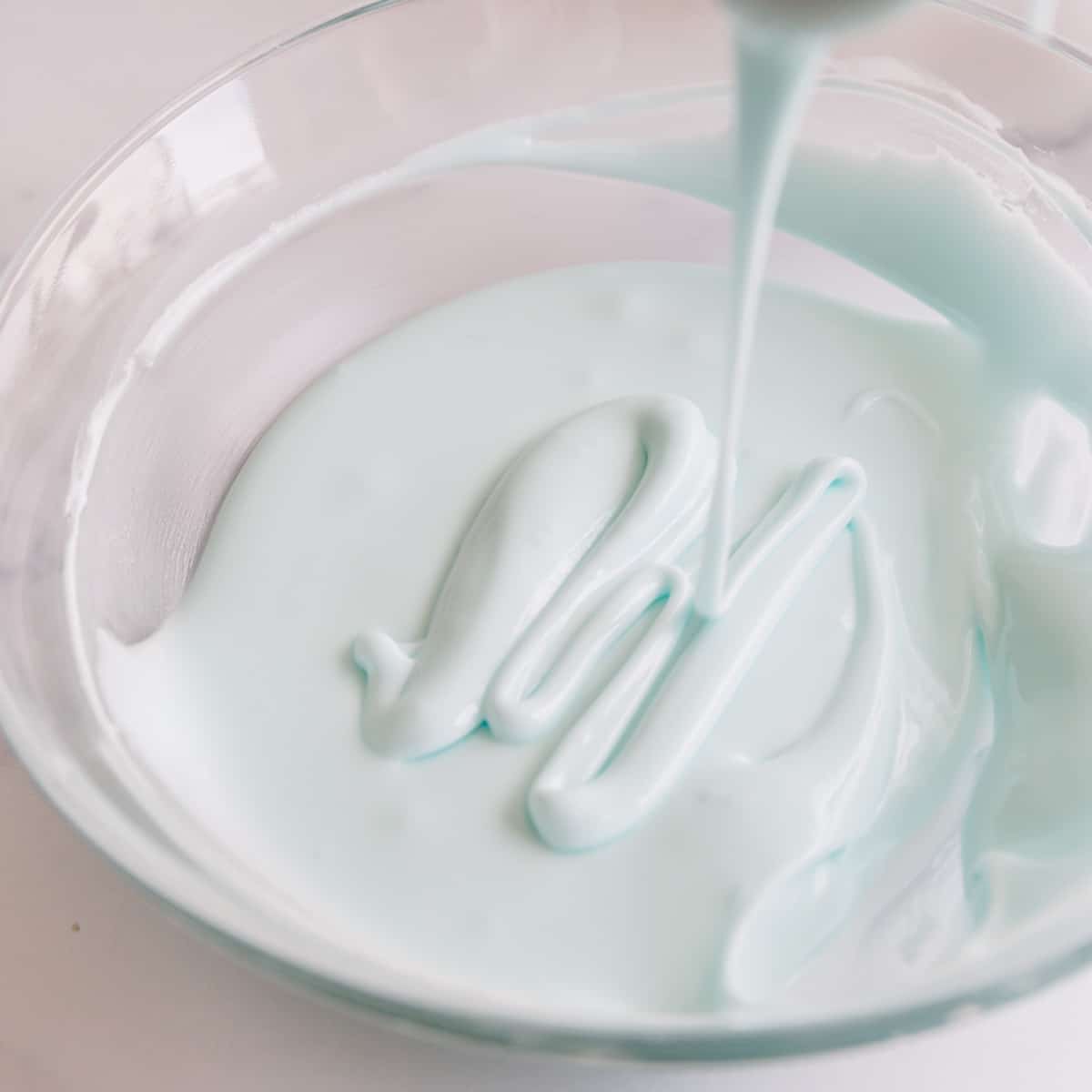 blue royal icing in a bowl. 