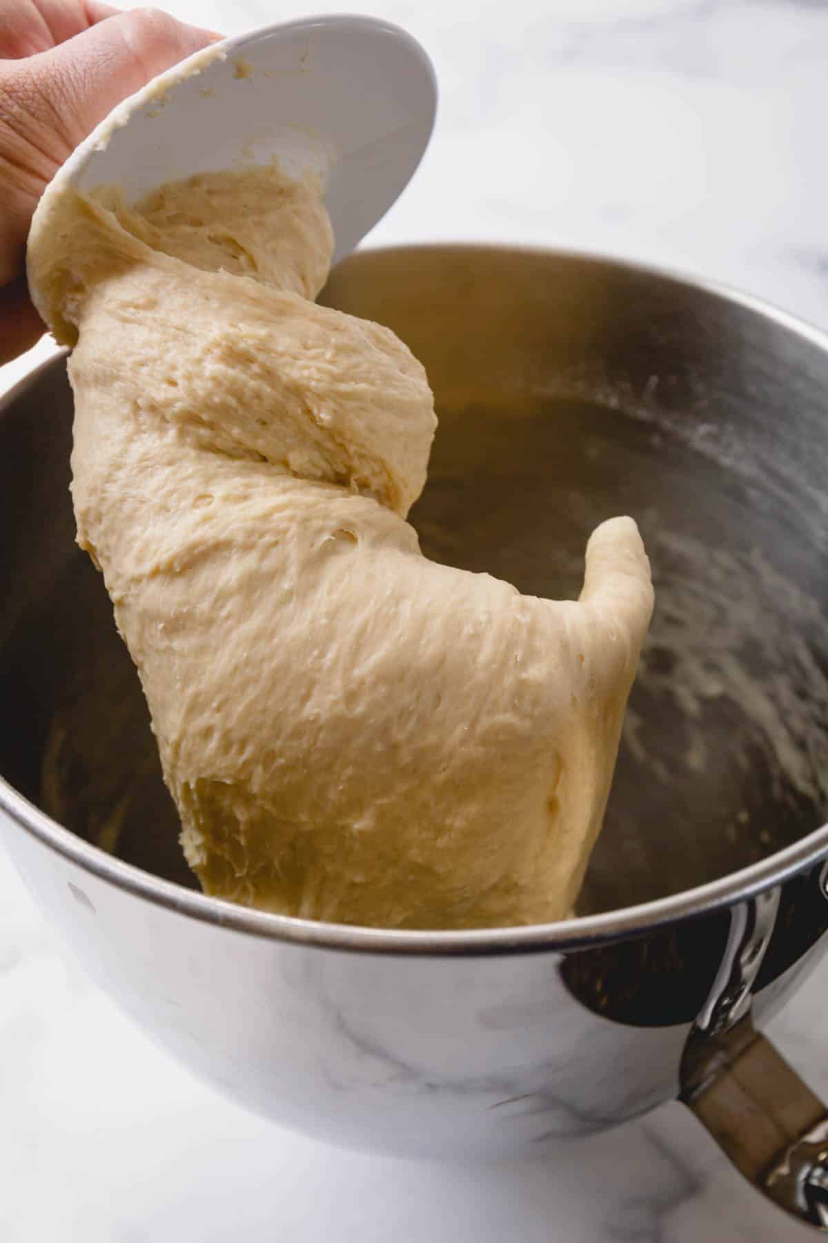 Caramel roll dough on a dough hook.