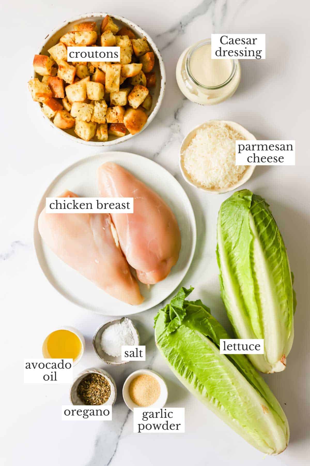 Ingredients needed to make a homemade chicken Caesar salad recipe.