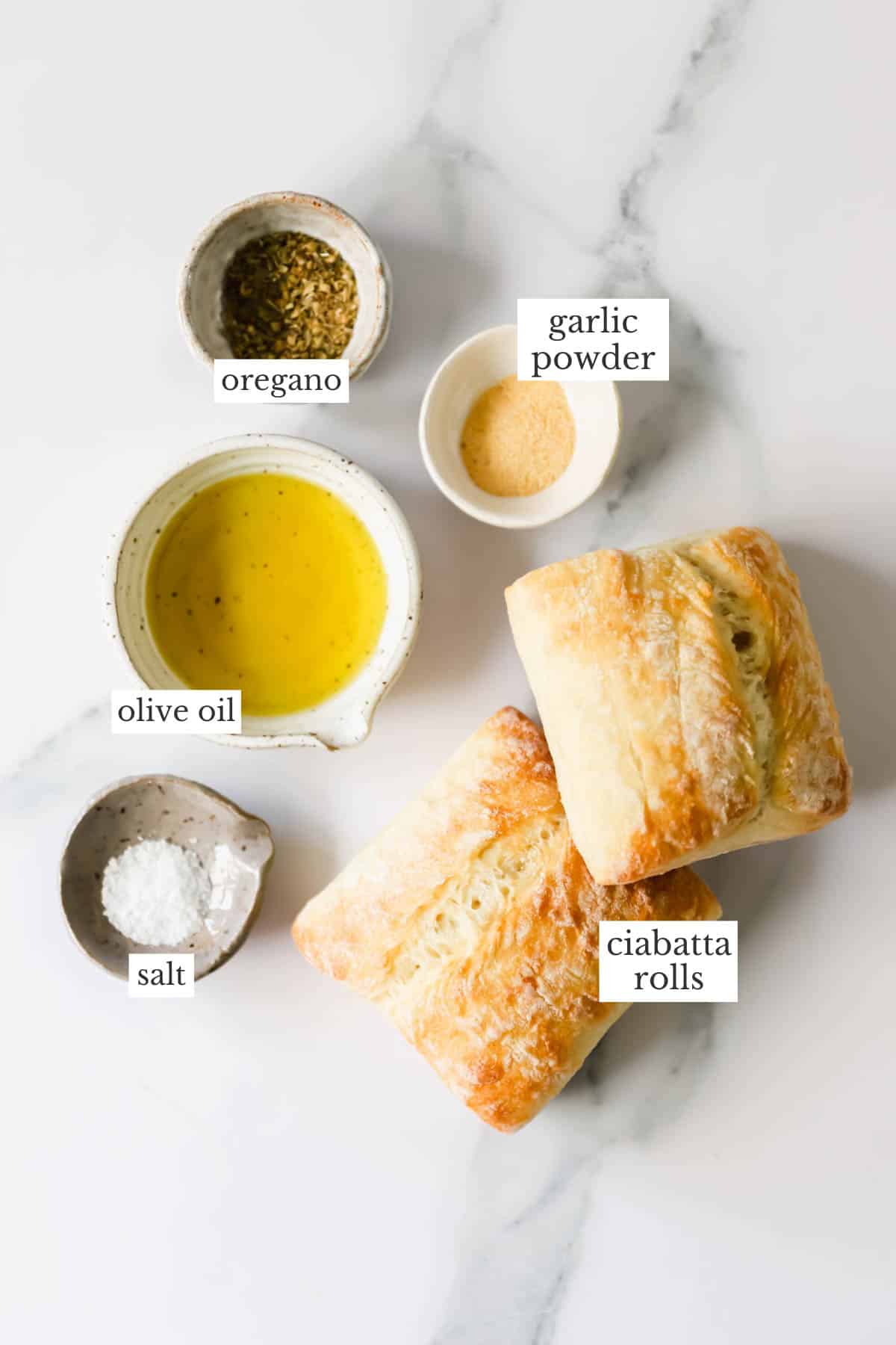 Ingredients needed to make homemade croutons with ciabatta rolls.