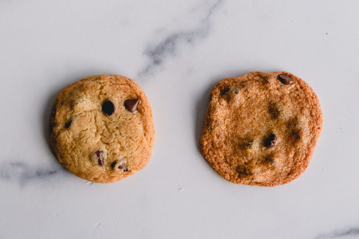 A thick chocolate chip cookie and thin, crispy chocolate chip cookies side by side.