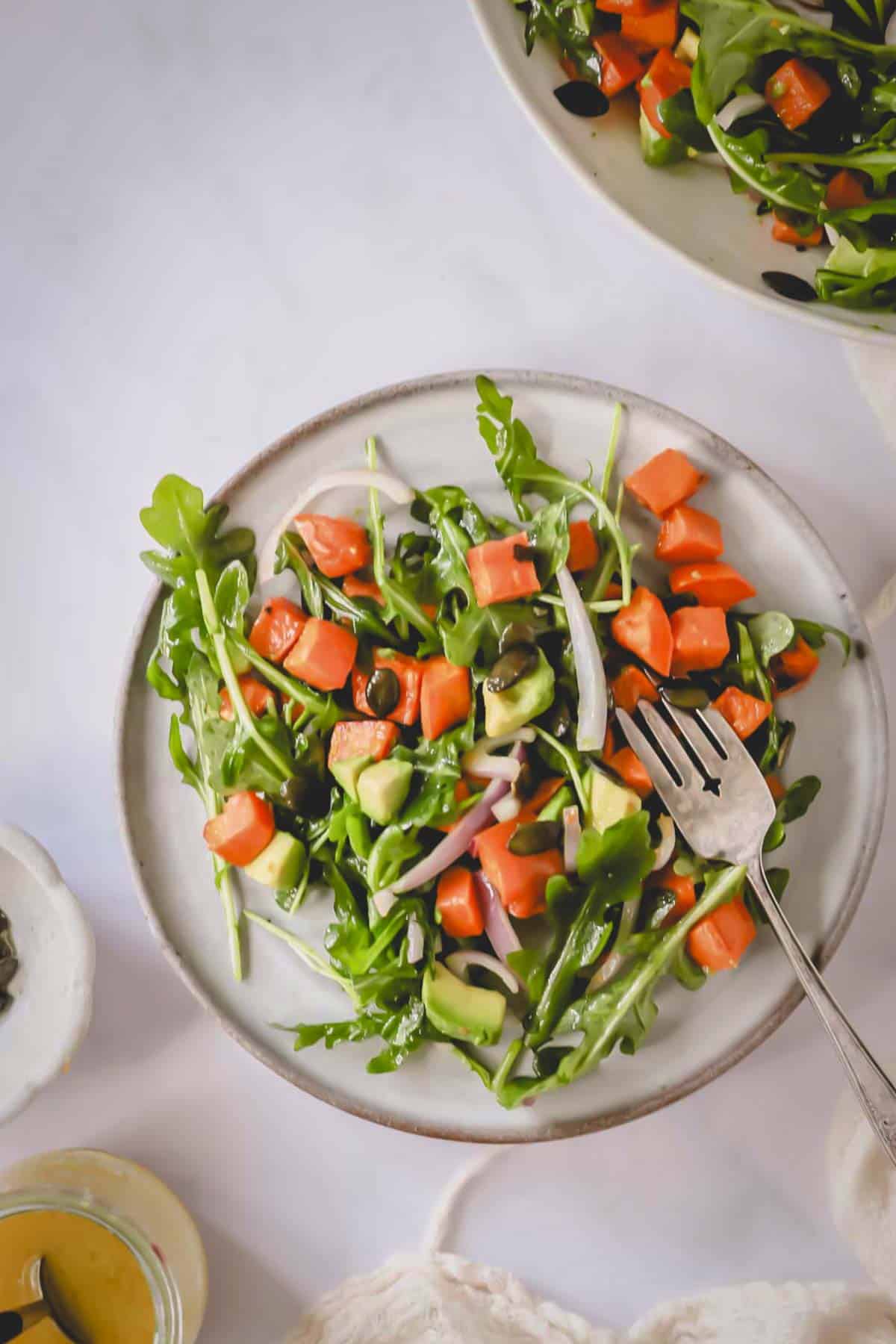 Overhead image of sweet potato salad on a plate with a fork.