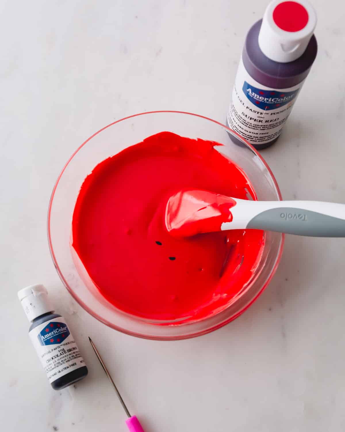 A bowl of bright red royal icing.