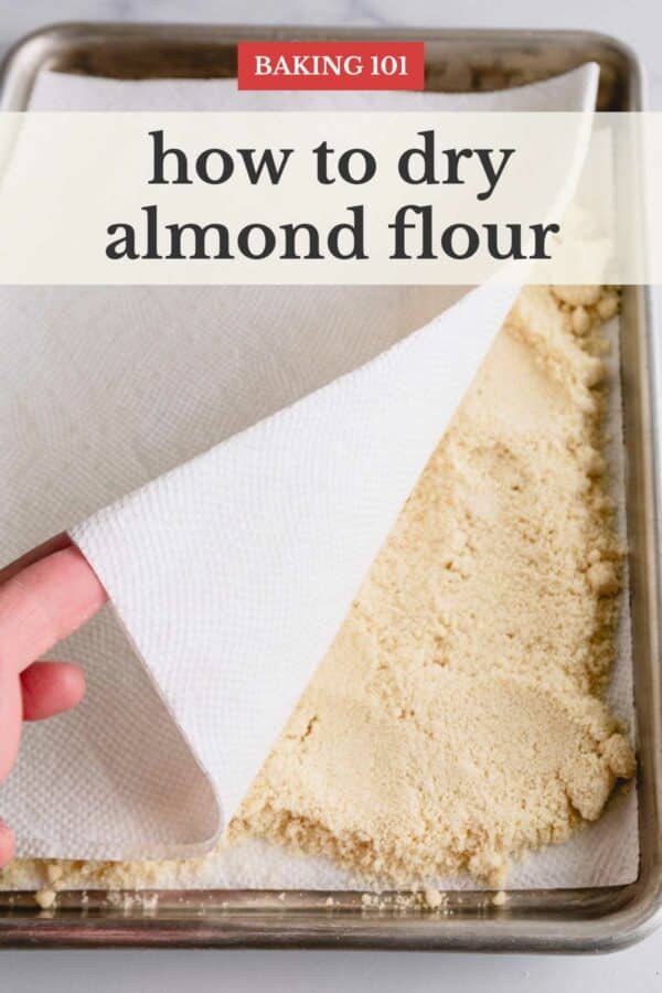 Almond flour spread on a baking sheet and topped with paper towel.