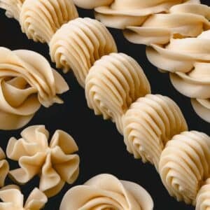 Piped designs with vanilla Russian buttercream frosting.