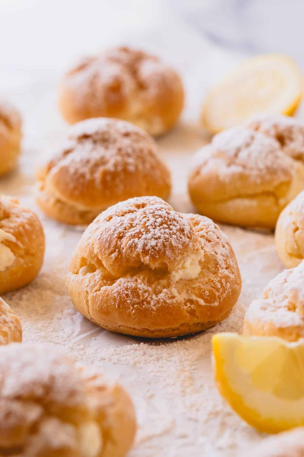 Lemon creme puffs topped with powdered sugar.