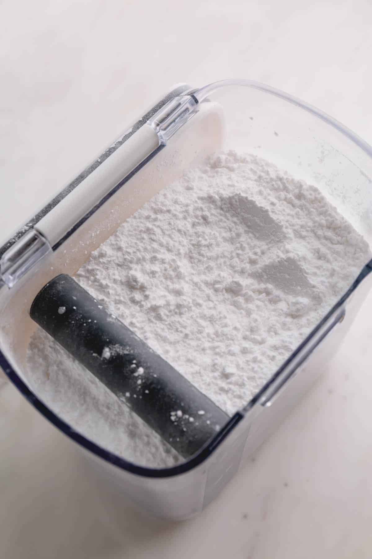 A container of powdered sugar.