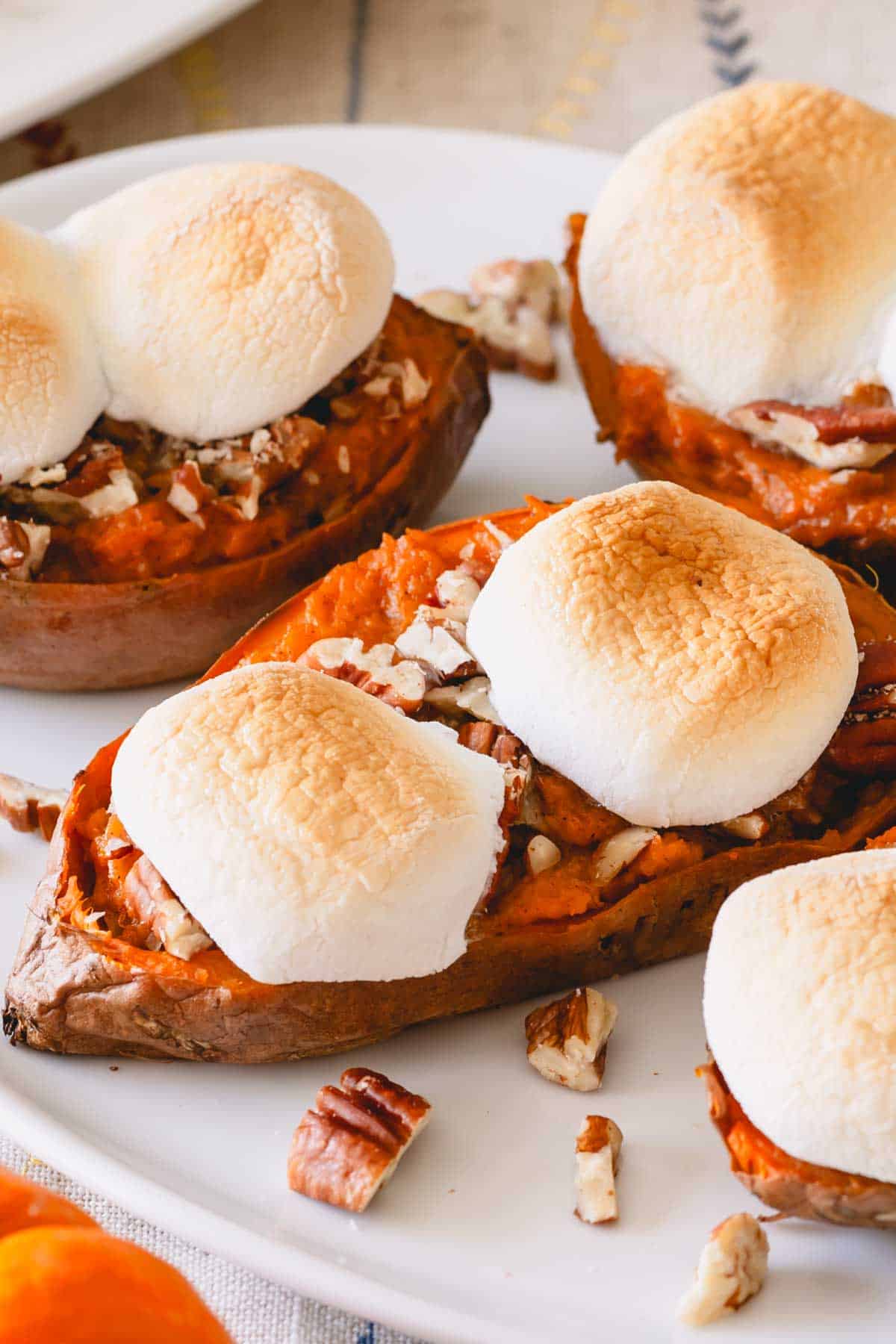 Toasted marshmallow twice baked sweet potatoes on a plate.