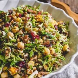 Warm quinoa Brussels sprouts salad with chickpeas in a bowl.