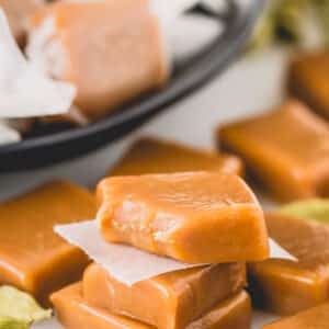 Cardamom caramel candies with one missing a corner.