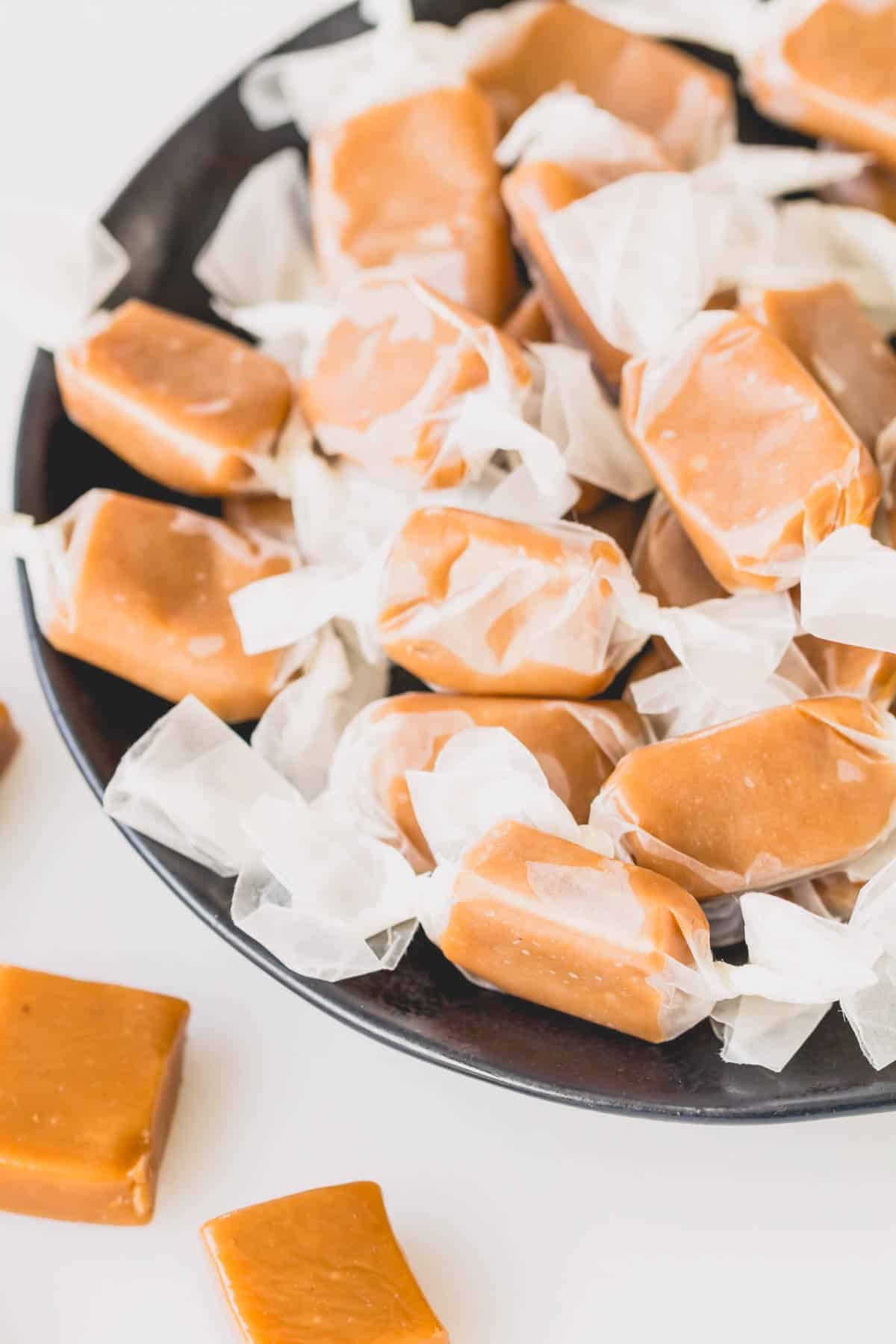 A bowl of wrapped cardamom caramel candies.