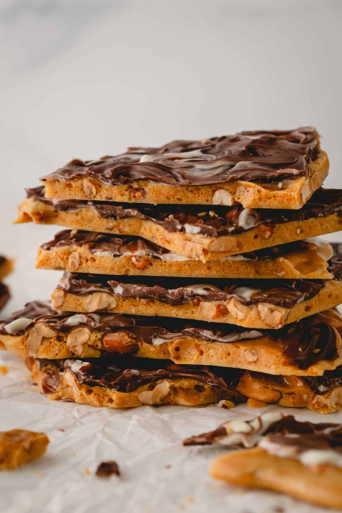 A stack of chocolate peanut brittle pieces.