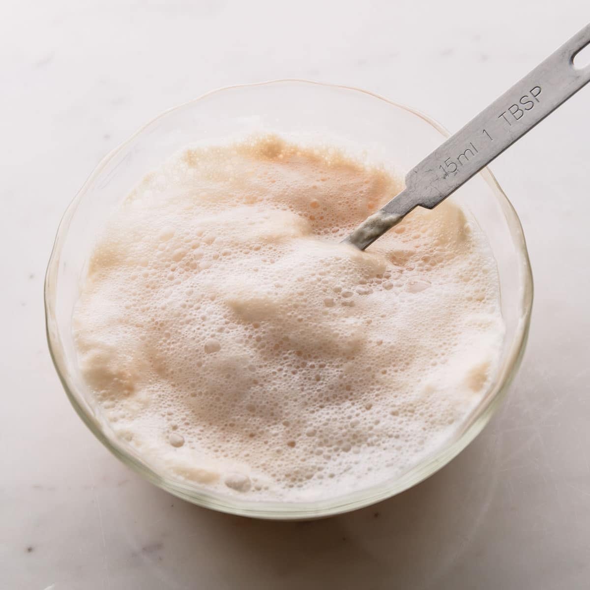 Yeast being activated in a bowl.