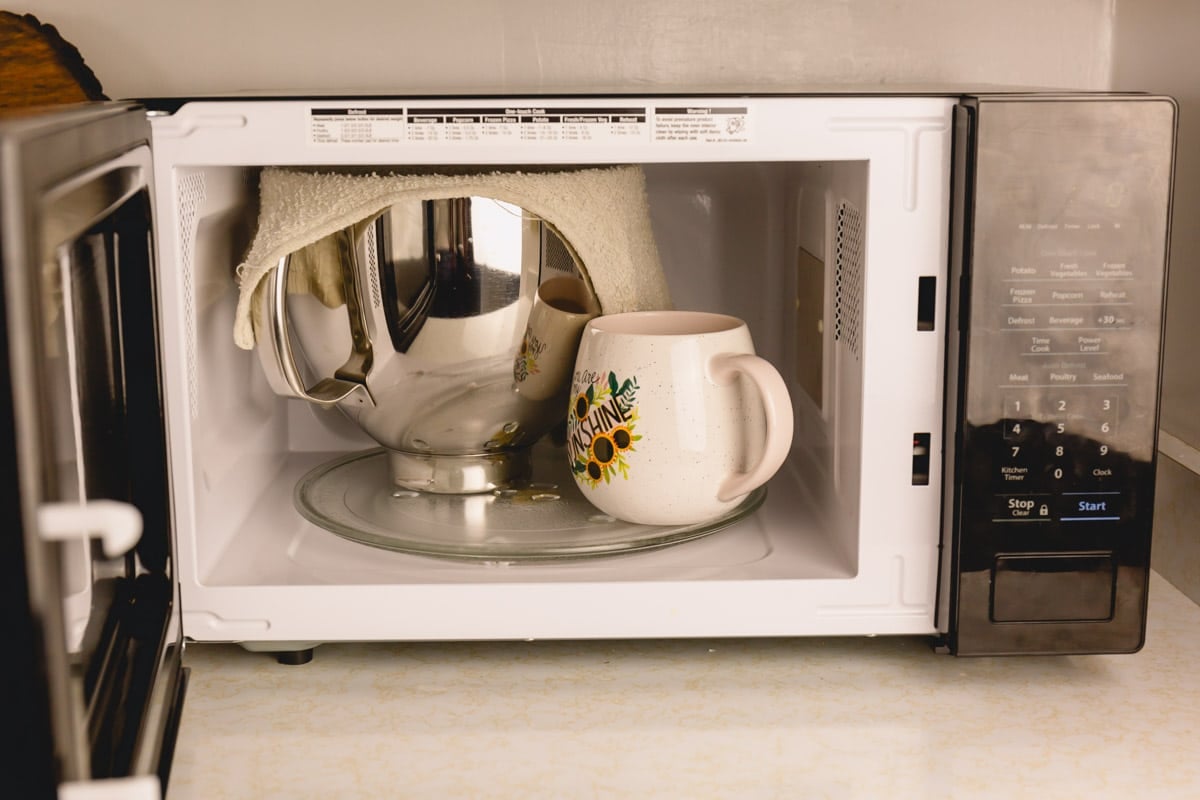 French bread dough being proofed in a microwave.