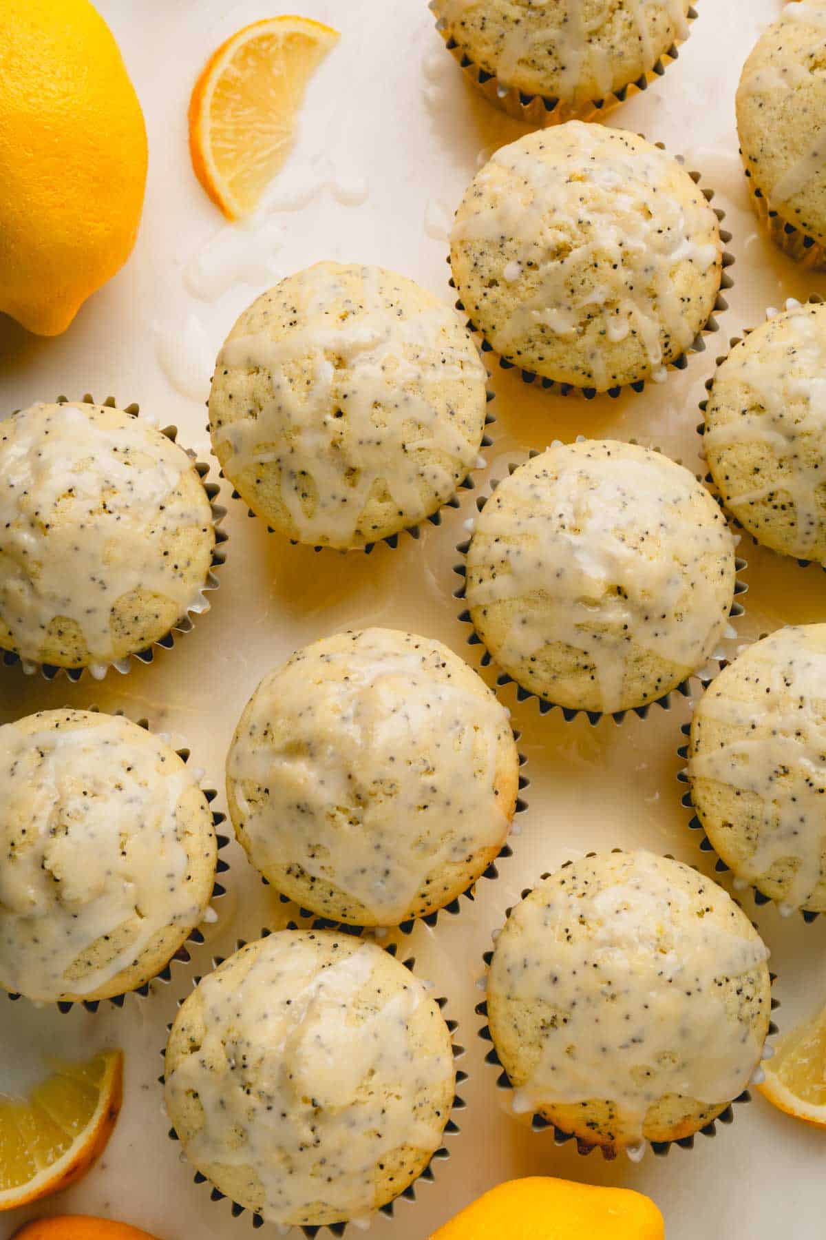 Lemon poppy seed muffins topped with a lemon glaze.