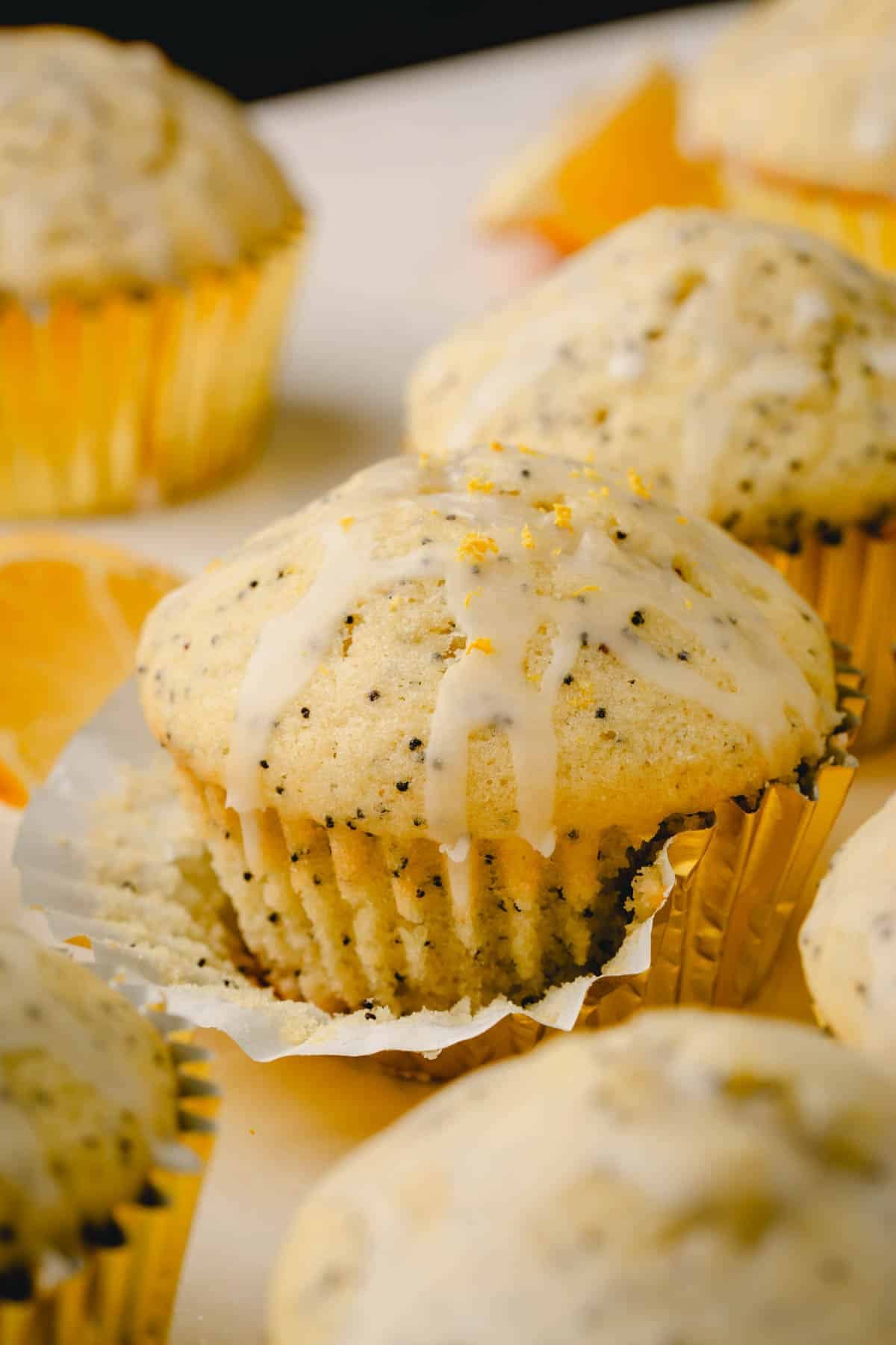 Lemon poppy seed muffins topped with a lemon glaze.