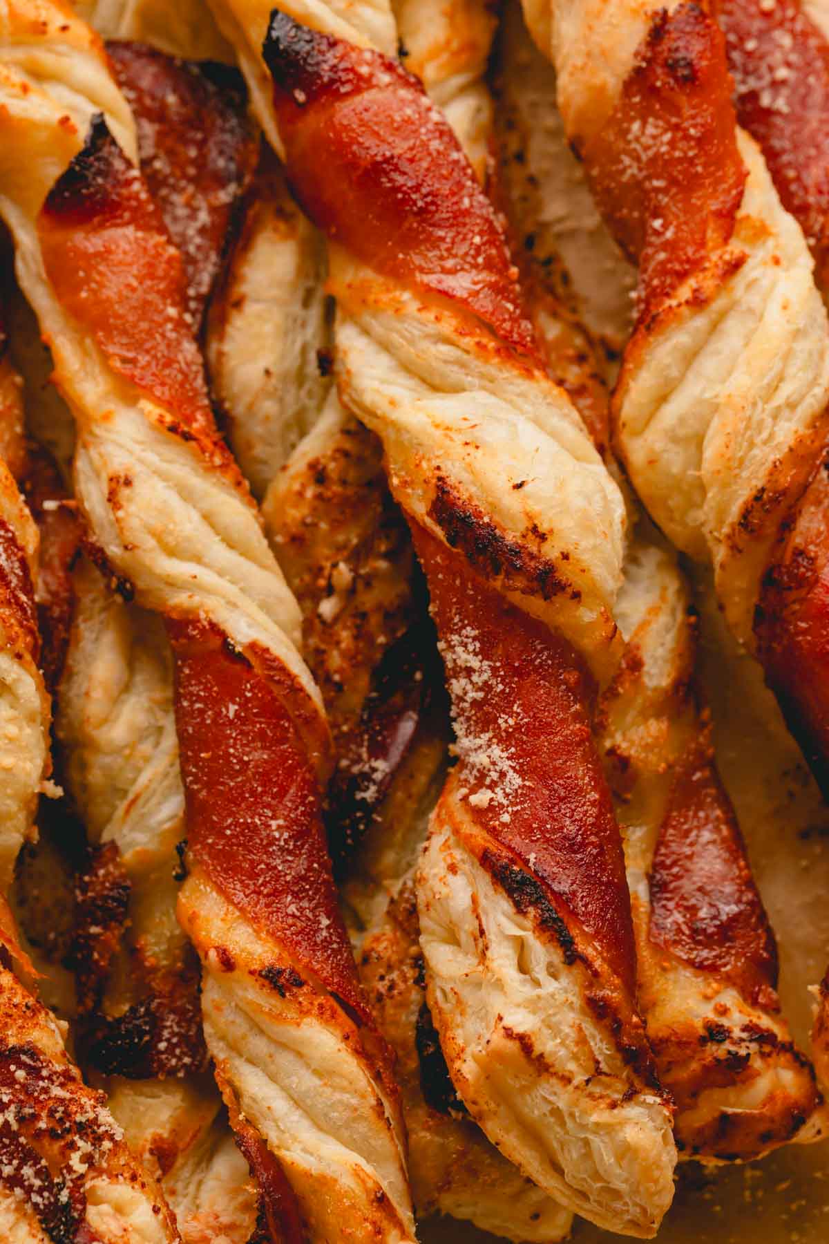 Puff pastry twists with apricot jam, prosciutto, and parmesan cheese.