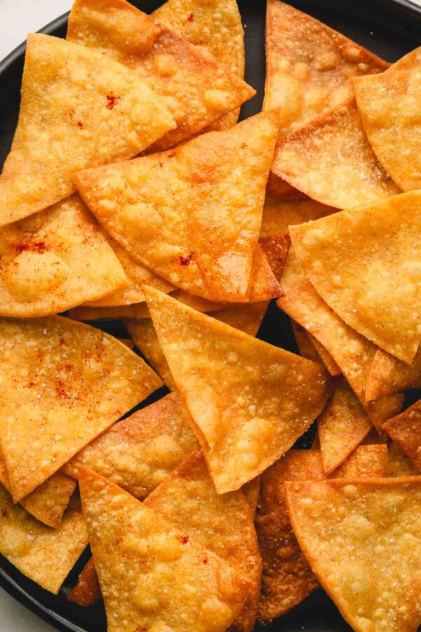 Homemade spicy tortilla chips on a plate.