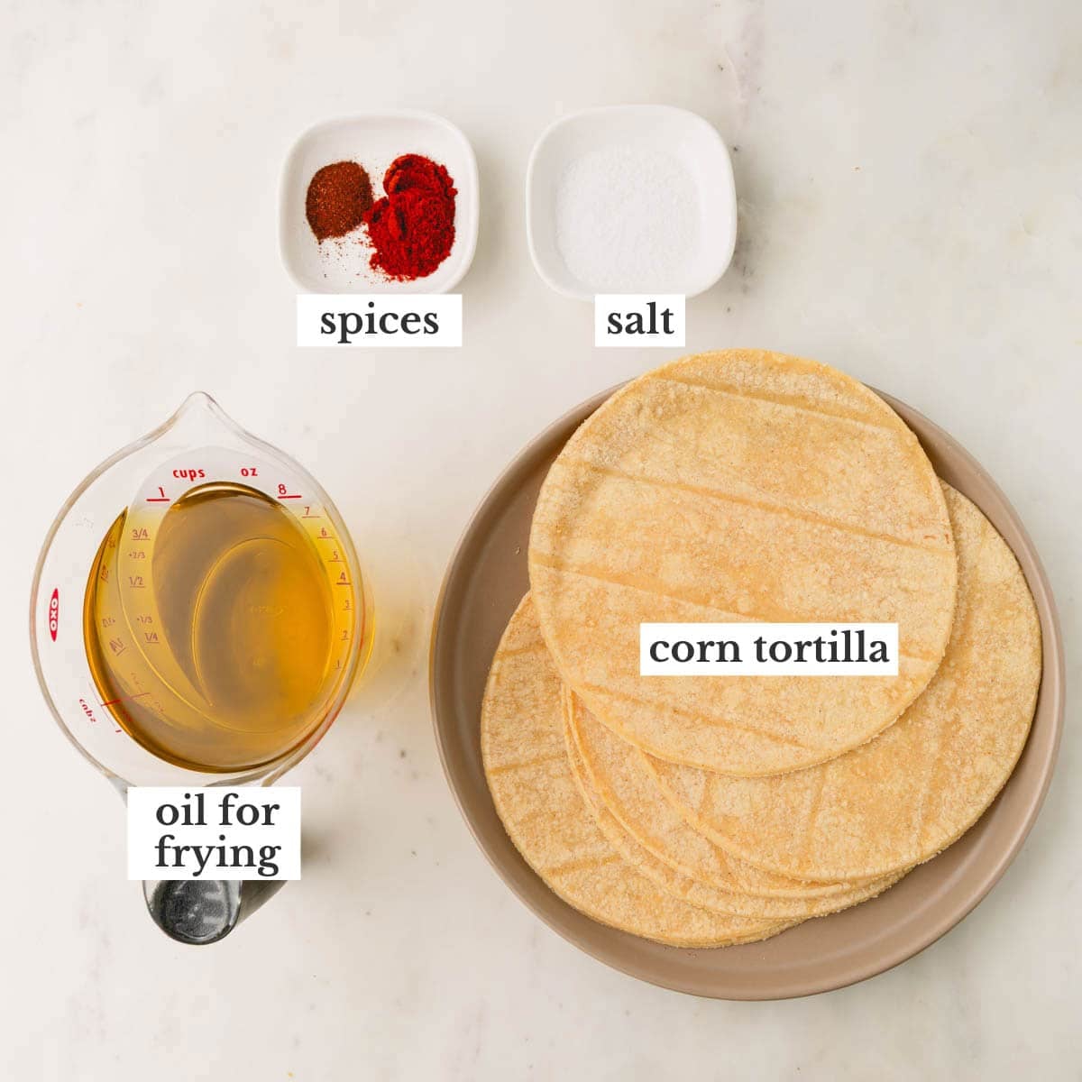 Spices, salt, corn tortillas, and oil to make spicy tortilla chips.