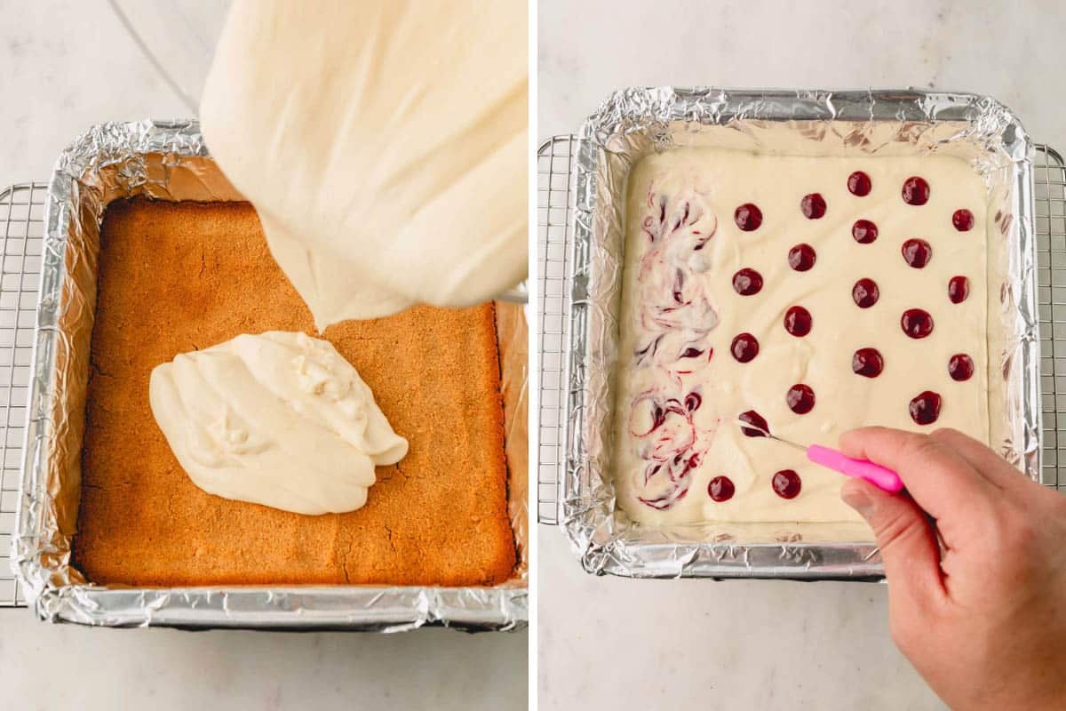 Cheesecake filling being poured over graham cracker crust and strawberry sauce being swirled into the filling.