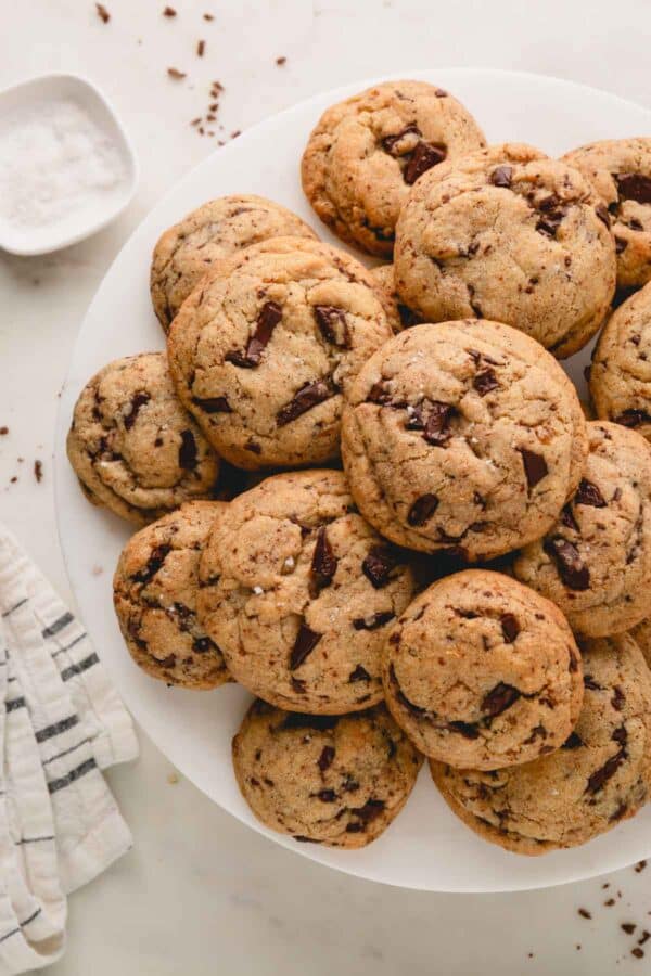 A plate of gourmet chocolate chip cookies.