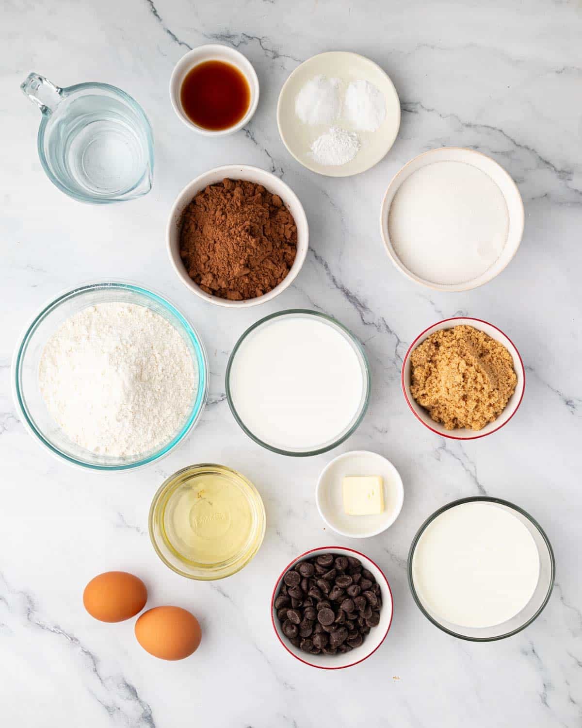Ingredients to make a chocolate heart cake.