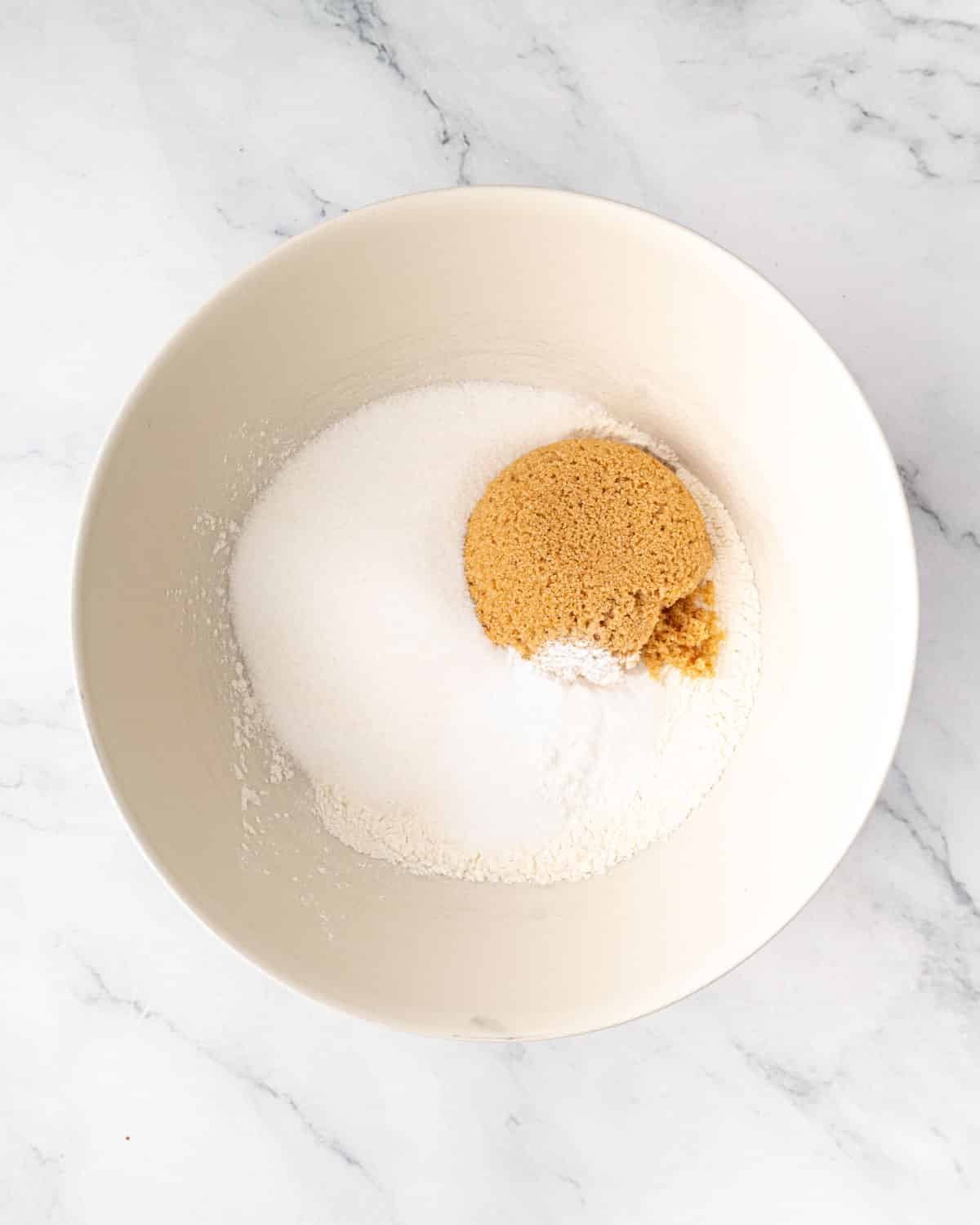 Dry ingredients for chocolate cake batter in a bowl.