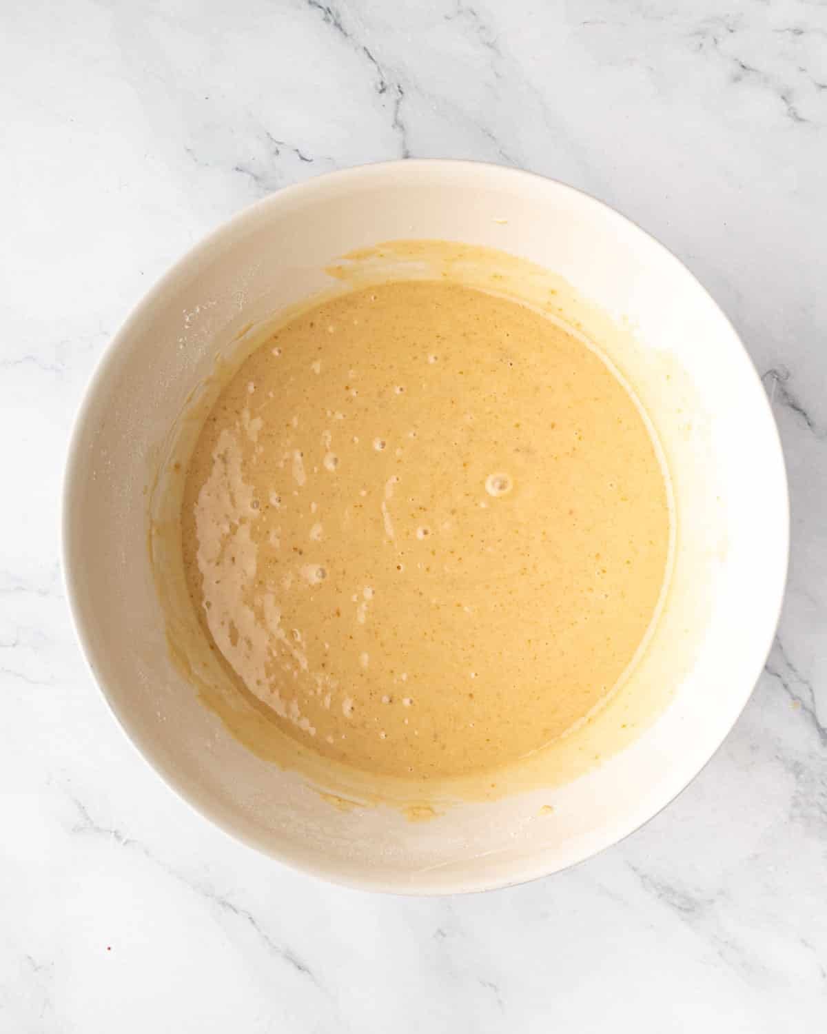 A bowl of chocolate cake batter ingredients.