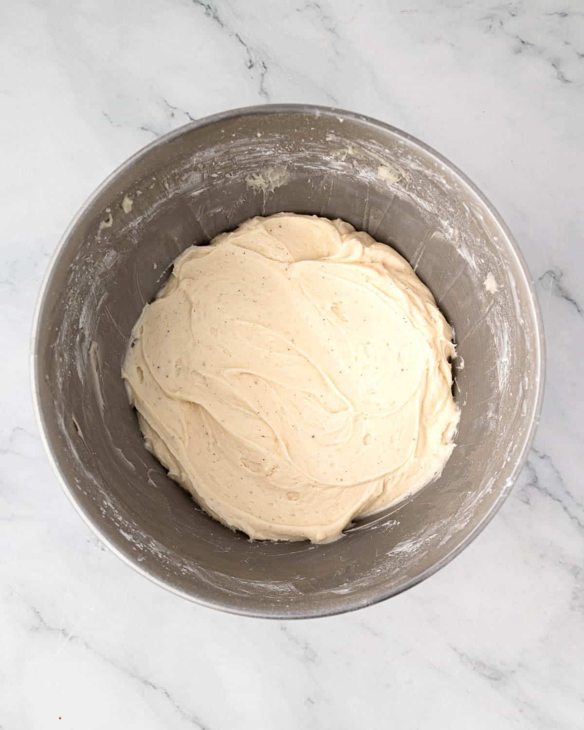 Cream cheese frosting in a bowl.