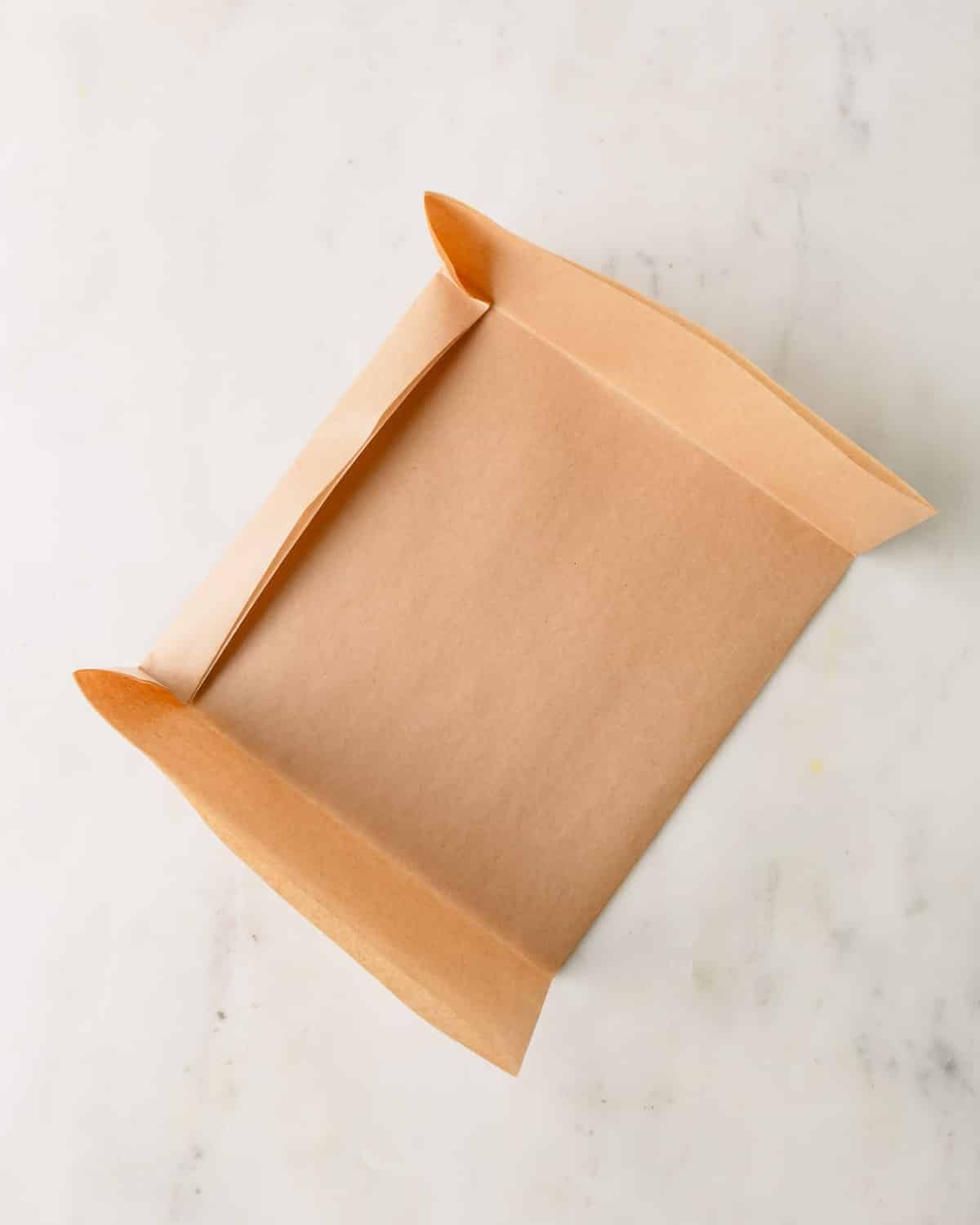 Folding parchment paper.