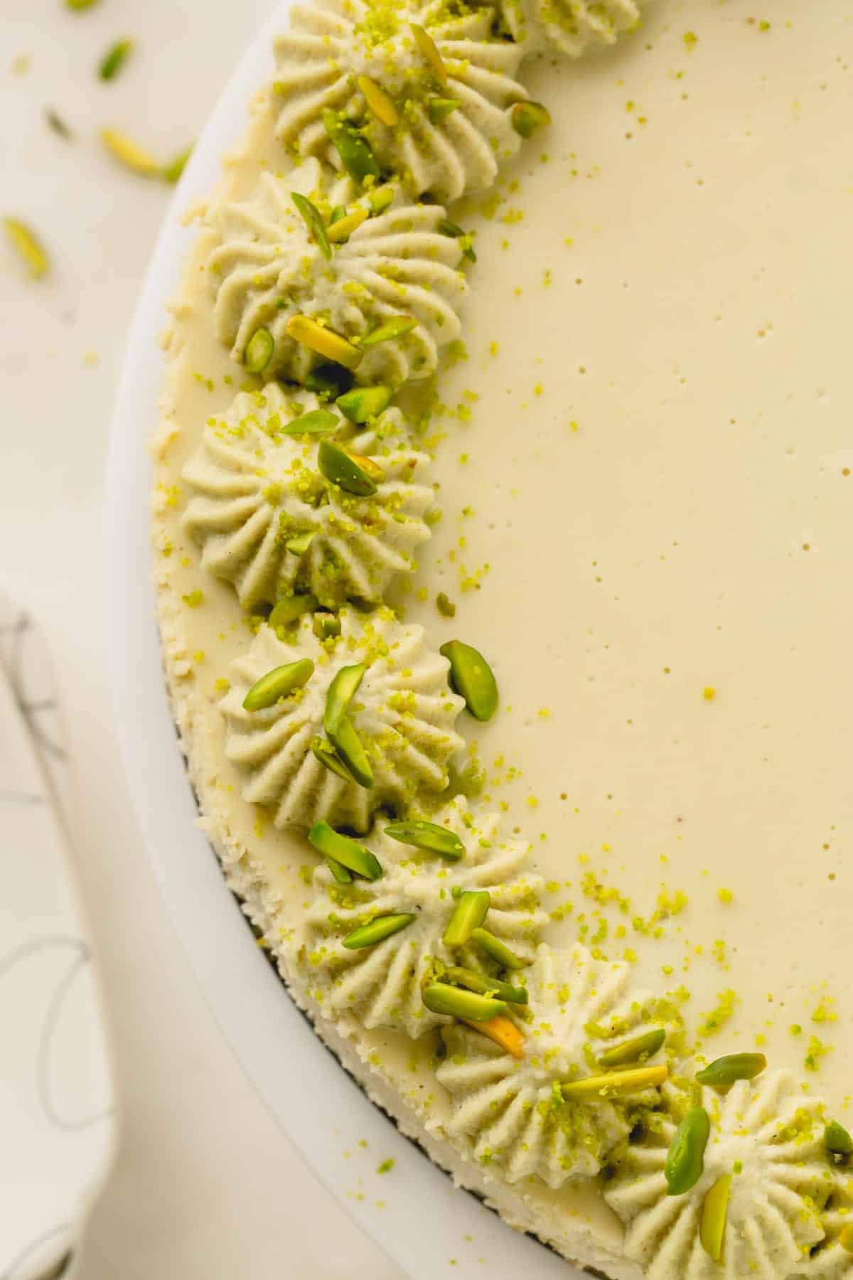 Overhead image of half of a pistachio cheesecake.