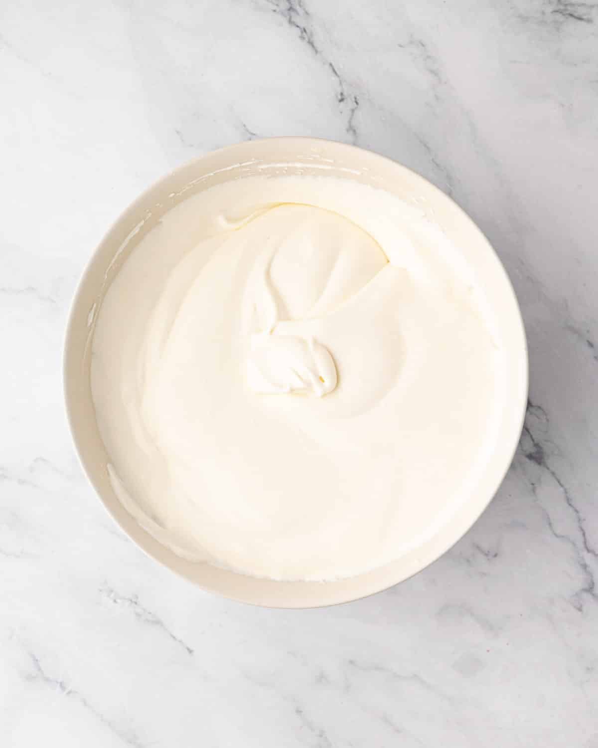 Mascarpone cream in a white bowl.