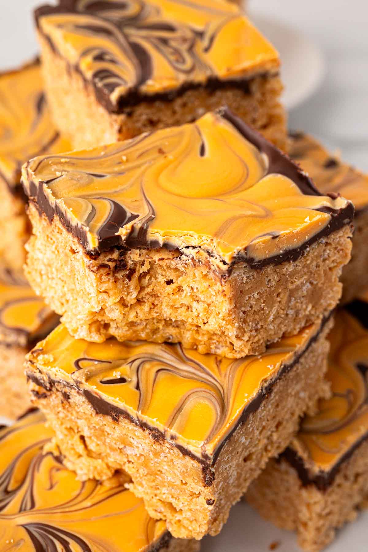 Scotcharoo bars stacked on top of each other.