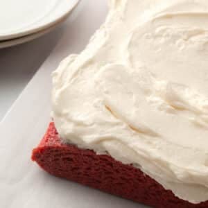 Ermine frosting spread onto a red velvet sheet cake.