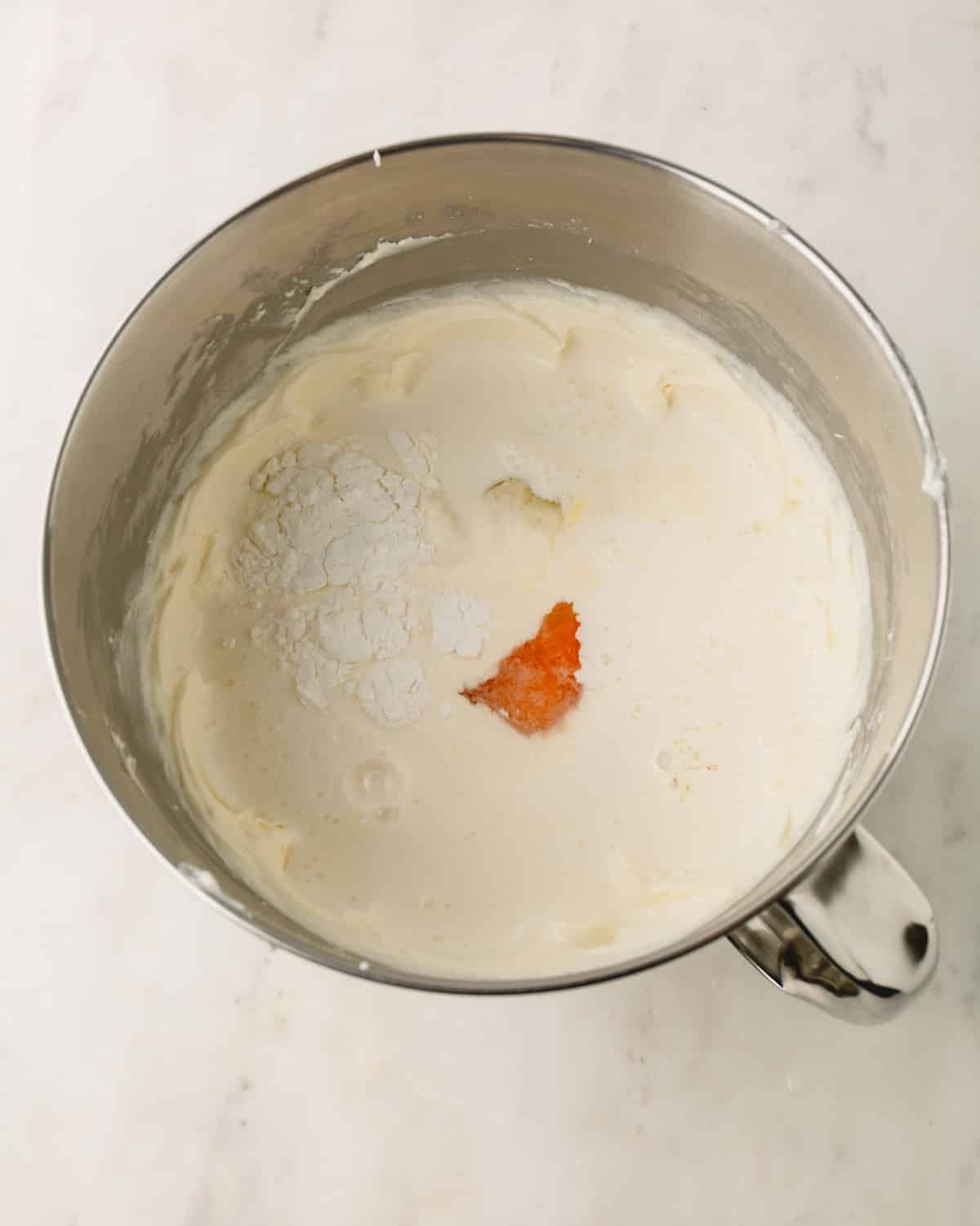 Cream, eggs, cornstarch, and salt added to the cream cheese.